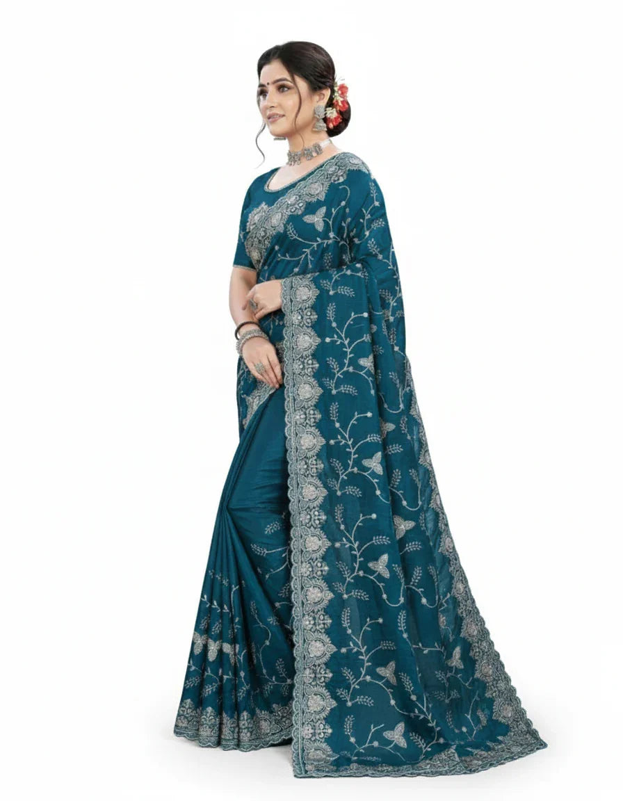 Jwalamukhi Silk Premium Saree in Teal Blue with Gold Zari Border & Floral Design – Elegant Traditional Wear