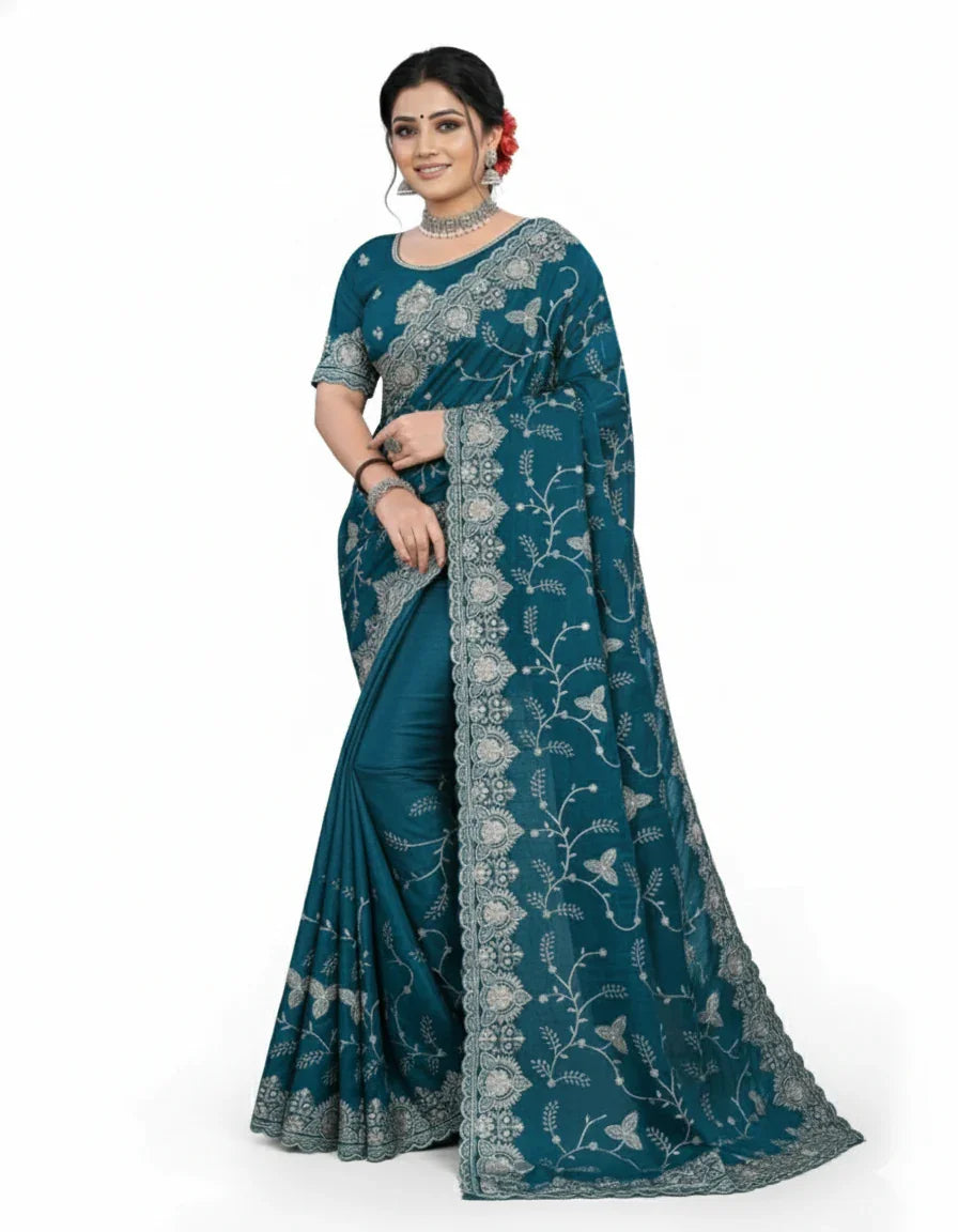 Jwalamukhi Silk Premium Saree in Teal Blue with Gold Zari Border & Floral Design – Elegant Traditional Wear