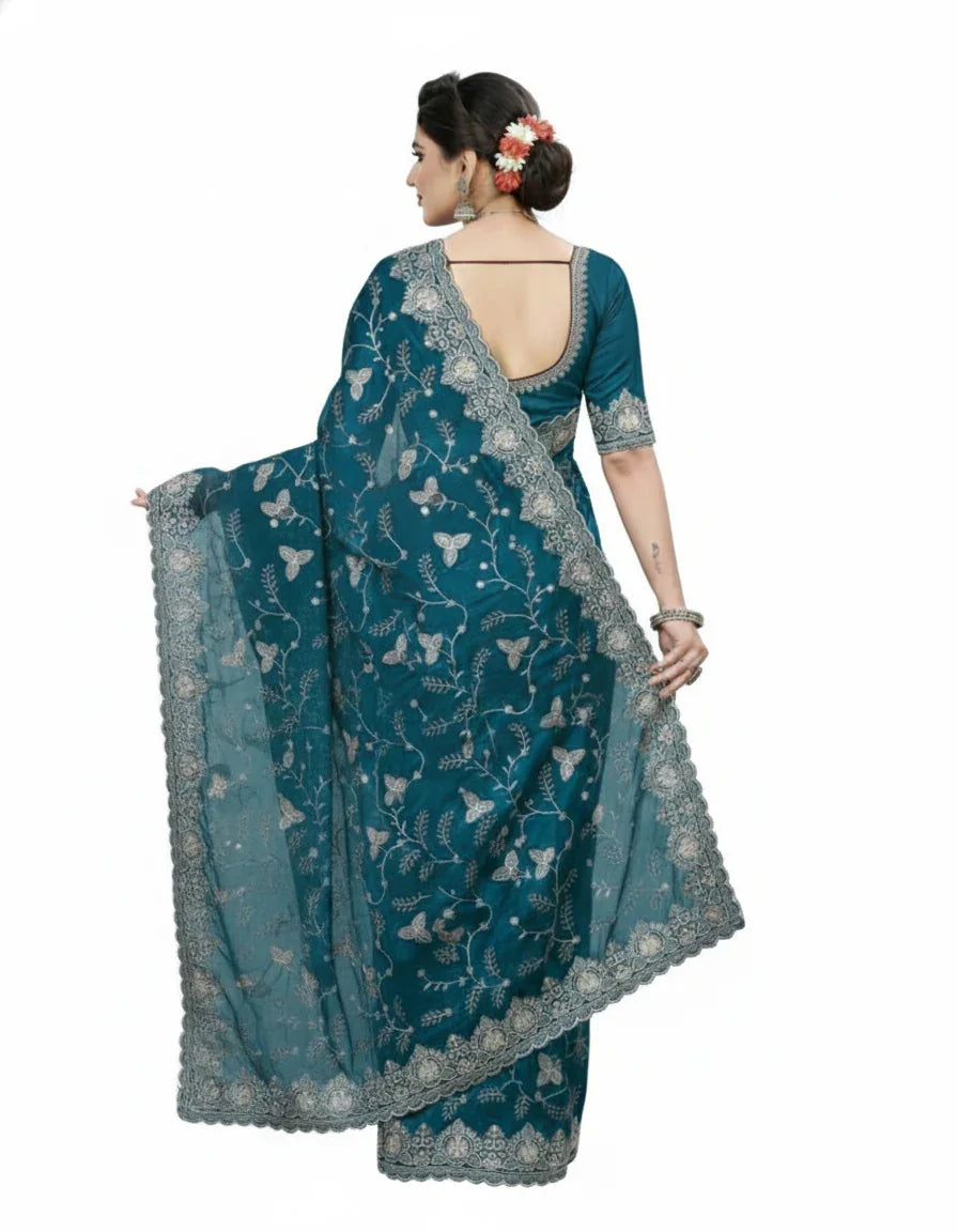 Jwalamukhi Silk Premium Saree in Teal Blue with Gold Zari Border & Floral Design – Elegant Traditional Wear